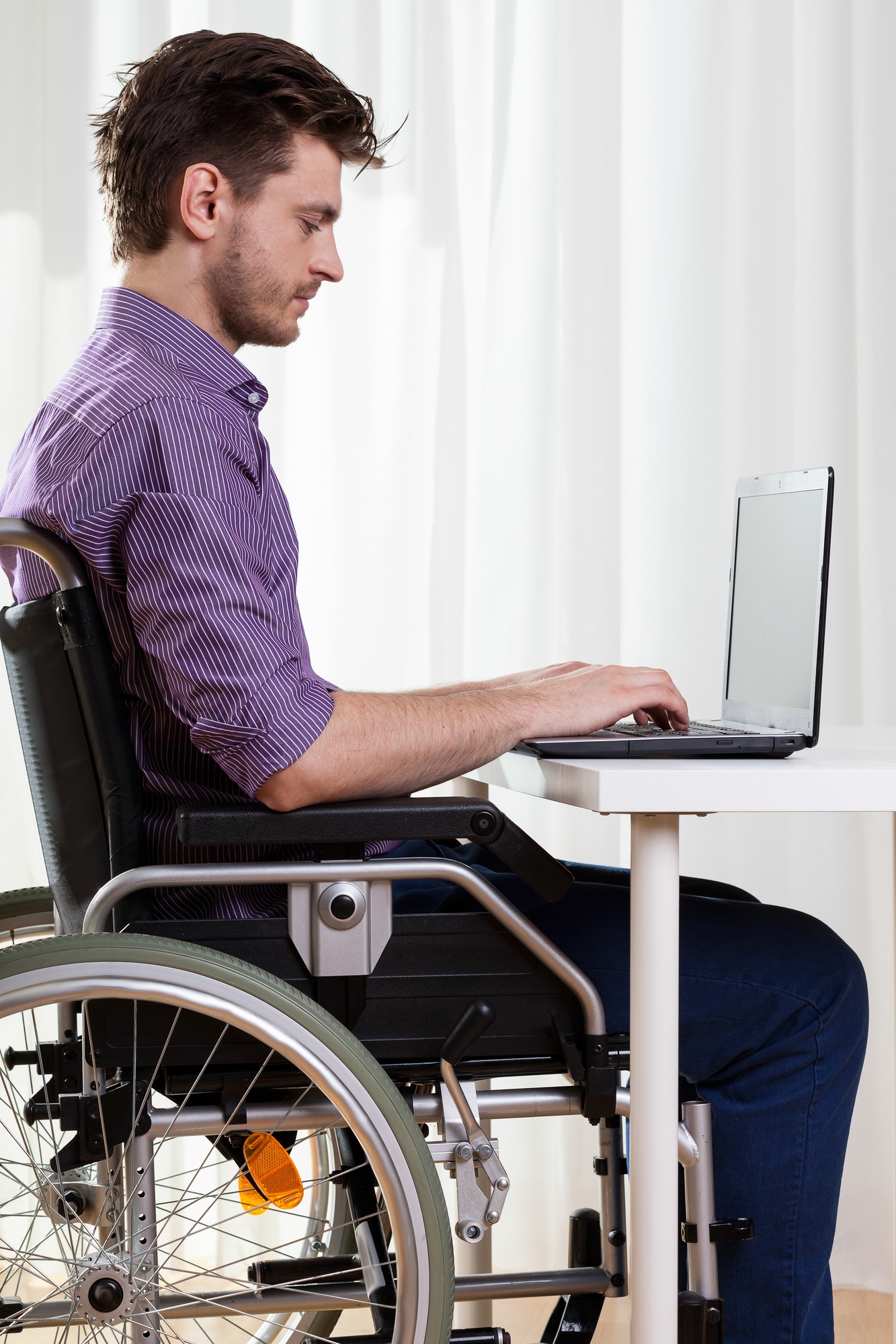 Disabled man surfing on the Internet